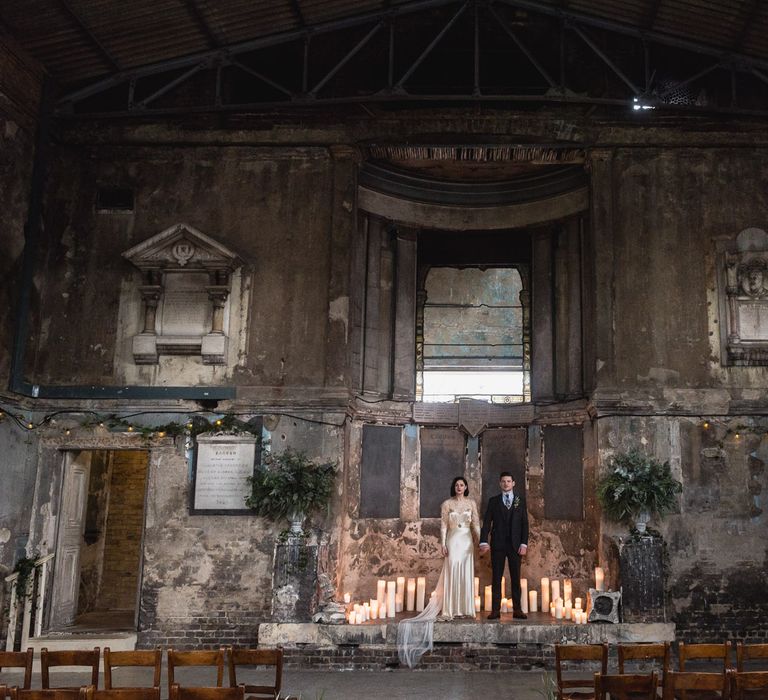 Bride in Story of My Dress Bridal Gown | Groom in Navy Suit from Tom James Tailors | Vintage Wedding at The Asylum & Town hall Hotel London | Kevin Fern Photography