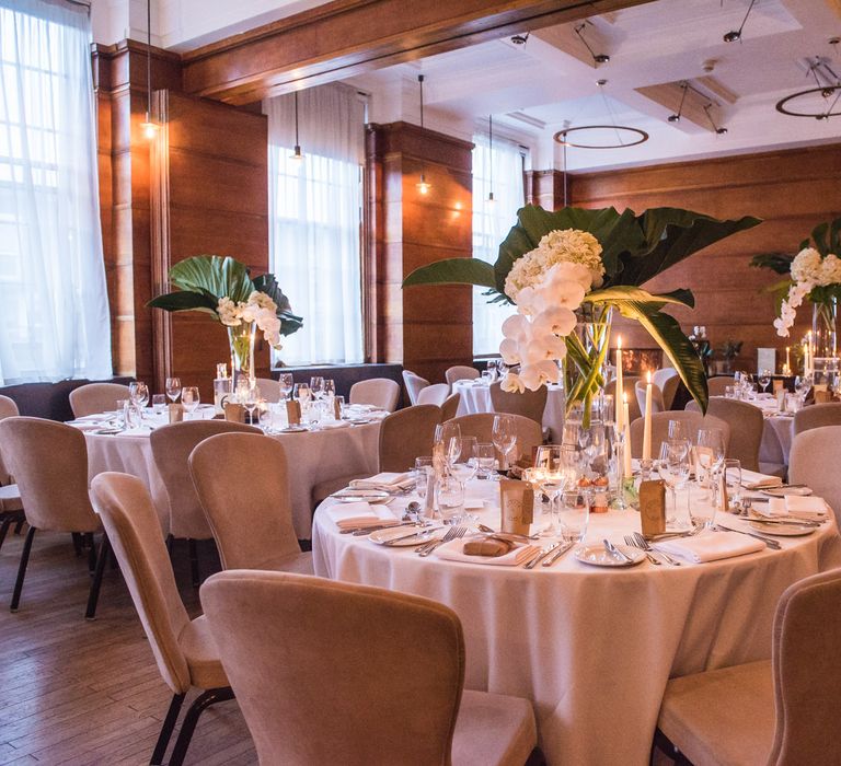 Fern Leaves, White Hydrangeas & Orchids Floral Centrepieces | Vintage Wedding at The Asylum & Town hall Hotel London | Kevin Fern Photography