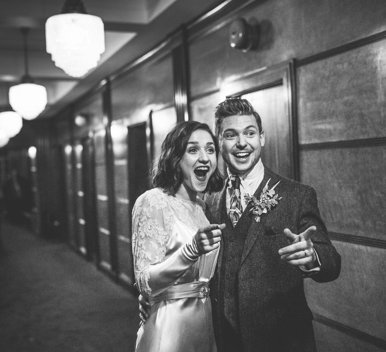 Bride in Story of My Dress Bridal Gown | Groom in Navy Suit from Tom James Tailors | Vintage Wedding at The Asylum & Town hall Hotel London | Kevin Fern Photography