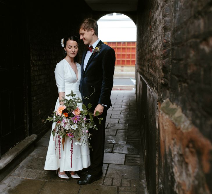 Elegant Bride in Delphine Manivet Prospere Wedding Dress & Groom in Velvet Jacket