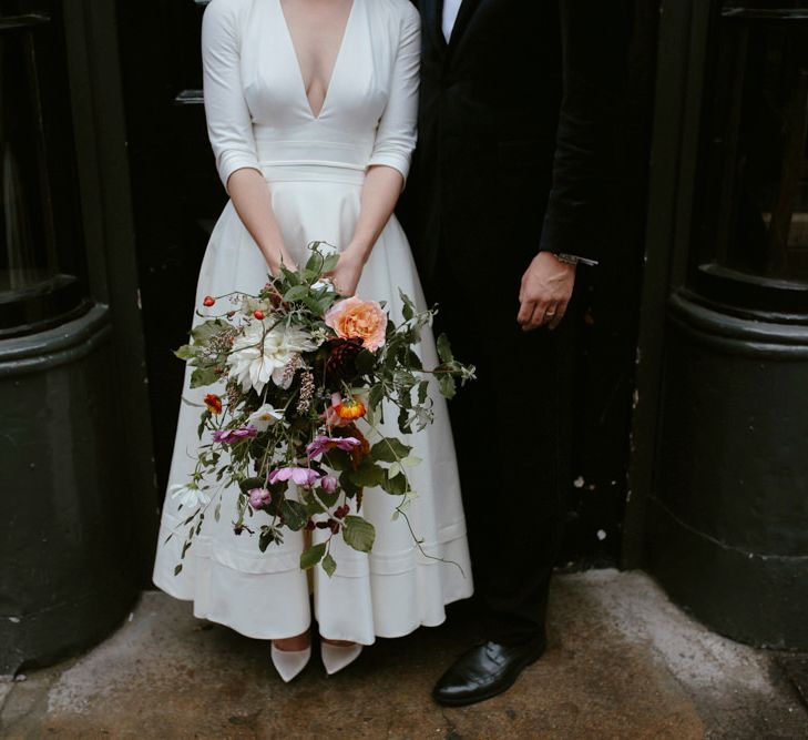 Elegant Bride in Delphine Manivet Prospere Wedding Dress & Groom in Velvet Jacket