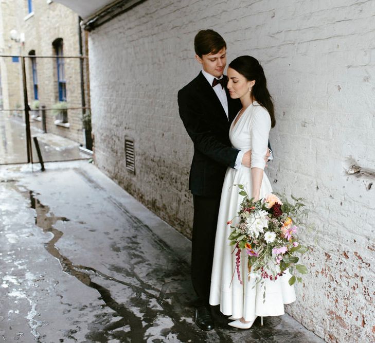 Elegant Bride in Delphine Manivet Prospere Wedding Dress & Groom in Velvet Jacket