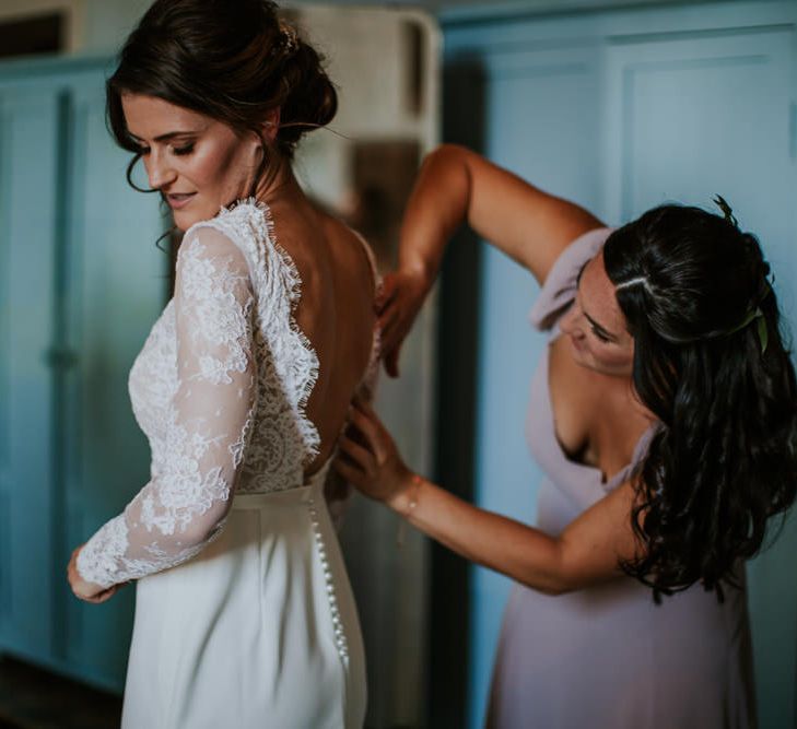 Bride in Long Lace Sleeve Gown from Morgan Davies | Bridesmaid in Reformation Dress | D&A Photography | Ben Walton Films