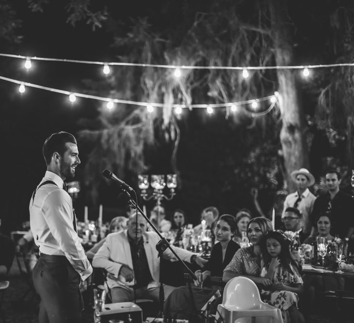 Wedding Speeches Under Festoon Lights | Bride in Morgan Davies Gown | Groom in Suit Supply | D&A Photography | Ben Walton Films