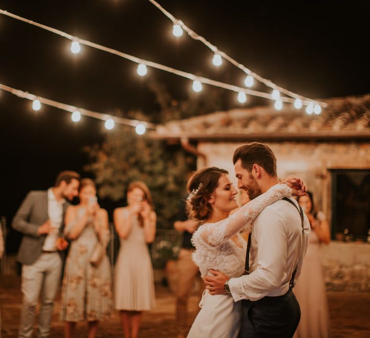 First Dance Under Festoon Lights | Bride in Morgan Davies Gown | Groom in Suit Supply | D&A Photography | Ben Walton Films