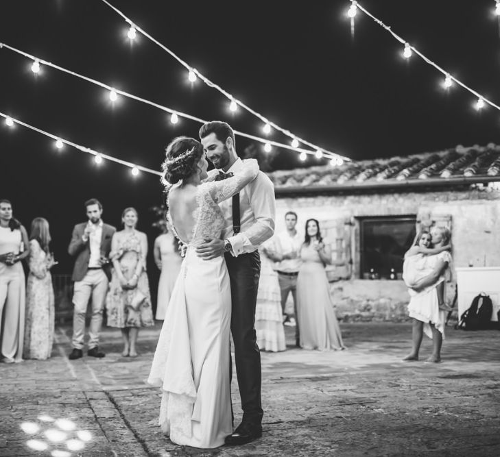 First Dance Under Festoon Lights | Bride in Morgan Davies Gown | Groom in Suit Supply | D&A Photography | Ben Walton Films