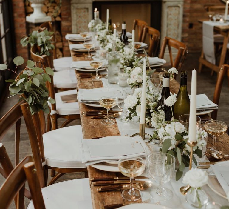 Wooden Trestle Tables With Soft Grey Runners, Taper Candles And White Florals For Wedding Image By The Curries