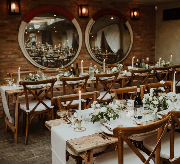 Wooden Trestle Tables With Soft Grey Runners, Taper Candles And White Florals For Wedding Image By The Curries