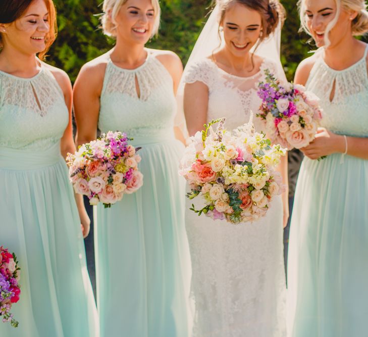 Lace Wedding Dress & Mint Bridesmaid Dresses from Vintage Rose Bridal | Navyblur Photography | Cinematic Tide Films