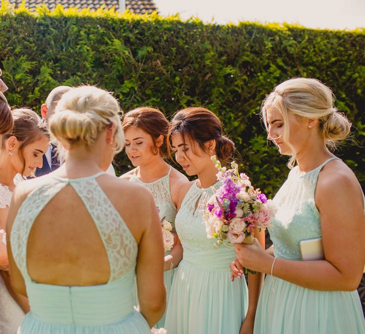 Lace Wedding Dress & Mint Bridesmaid Dresses from Vintage Rose Bridal | Navyblur Photography | Cinematic Tide Films