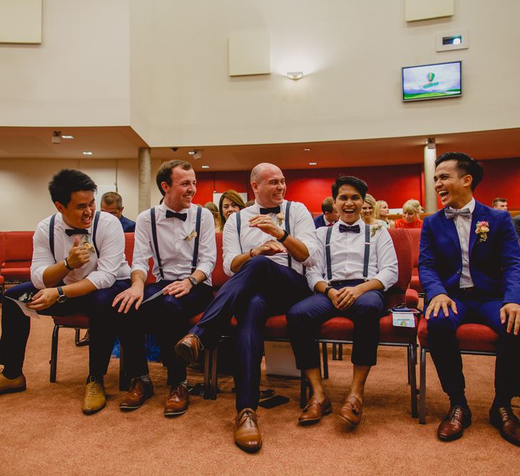 Groom in H&M Blue Suit & Groomsmen in Trousers, Braces & Bow Ties | Navyblur Photography | Cinematic Tide Films