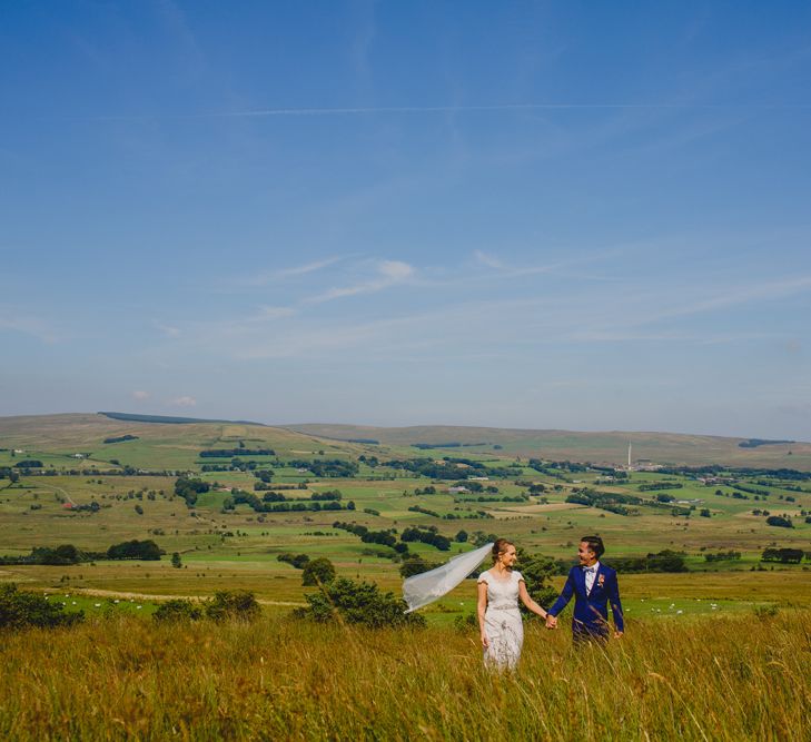 Bride in Lace Dress from Vintage Rose Bridal | Groom in H&M Navy Blue Suit | Navyblur Photography | Cinematic Tide Films