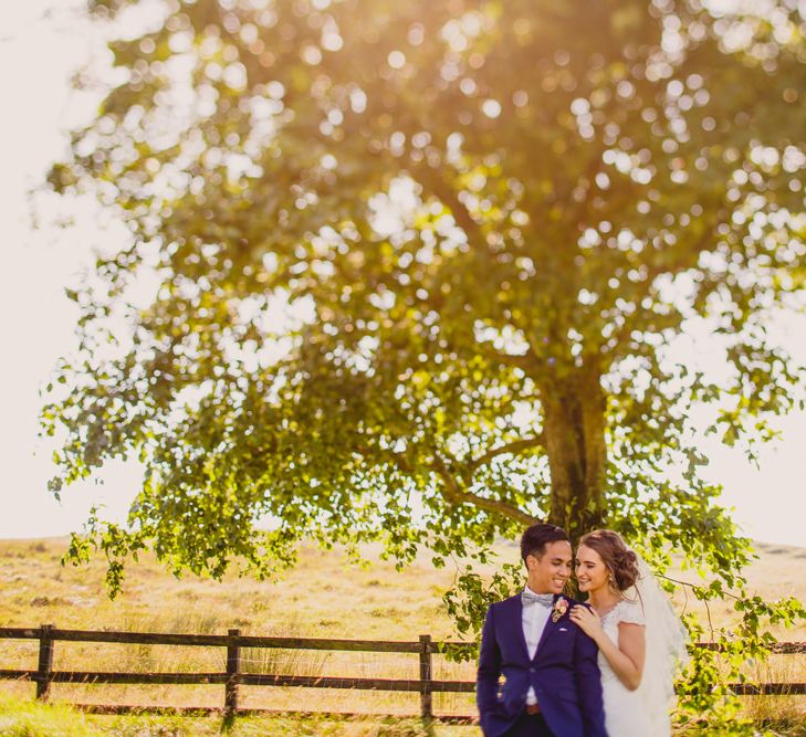 Bride in Lace Dress from Vintage Rose Bridal | Groom in H&M Navy Blue Suit | Navyblur Photography | Cinematic Tide Films