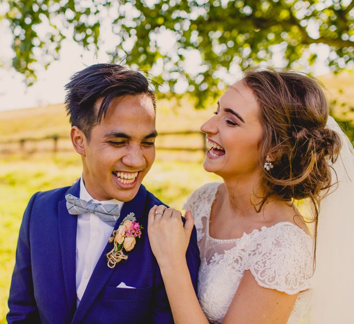 Bride in Lace Dress from Vintage Rose Bridal | Groom in H&M Navy Blue Suit | Navyblur Photography | Cinematic Tide Films