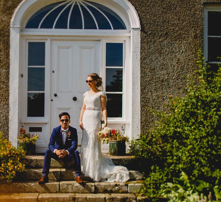 Bride in Lace Dress from Vintage Rose Bridal | Groom in H&M Navy Blue Suit | Navyblur Photography | Cinematic Tide Films