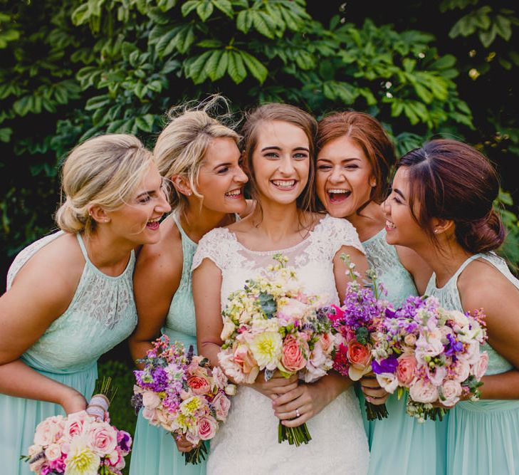 Bride in Lace Wedding Dress & Mint Bridesmaid Dresses from Vintage Rose Bridal | Navyblur Photography | Cinematic Tide Films