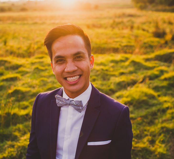 Groom in H&M Navy Blue Suit & Bow Tie | Navyblur Photography | Cinematic Tide Films