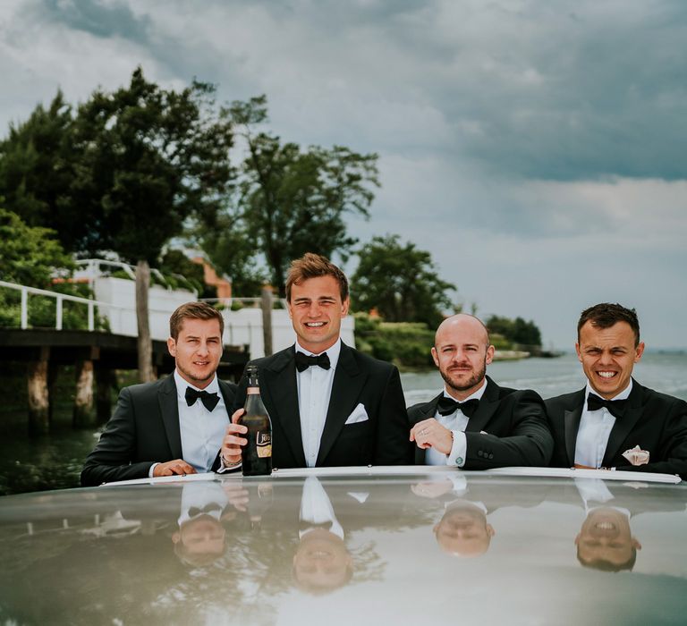 Boat Ride | Groomsmen in Black Tuxedos | Super Luxe Greek Wedding at The Cipriani in Venice | Bridgwood Wedding Photography