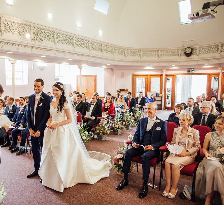 Bride in Aire Barcelona Bridal Gown & Groom in Ted Baker Church Ceremony