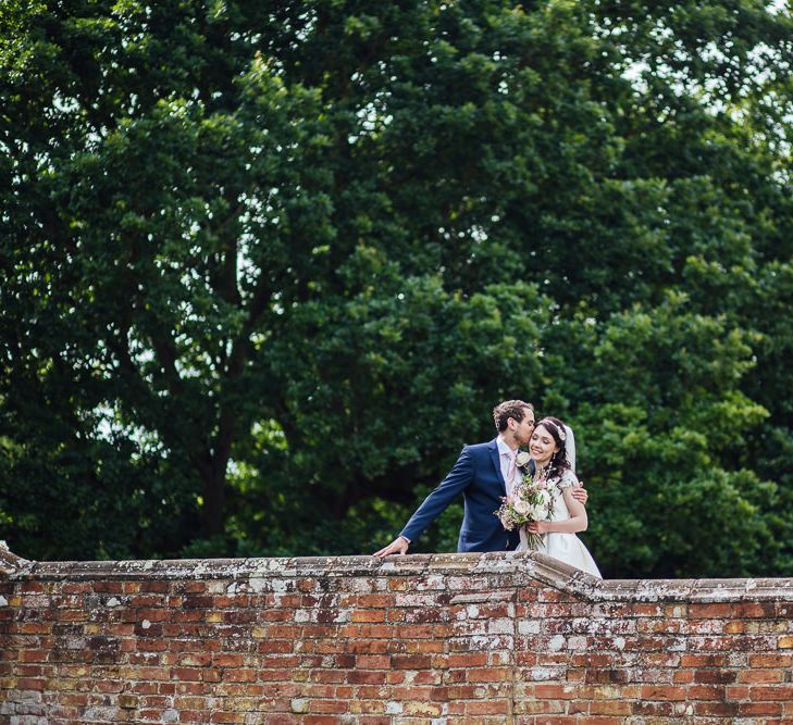 Bride in Aire Barcelona Bridal Gown & Groom in Ted Baker