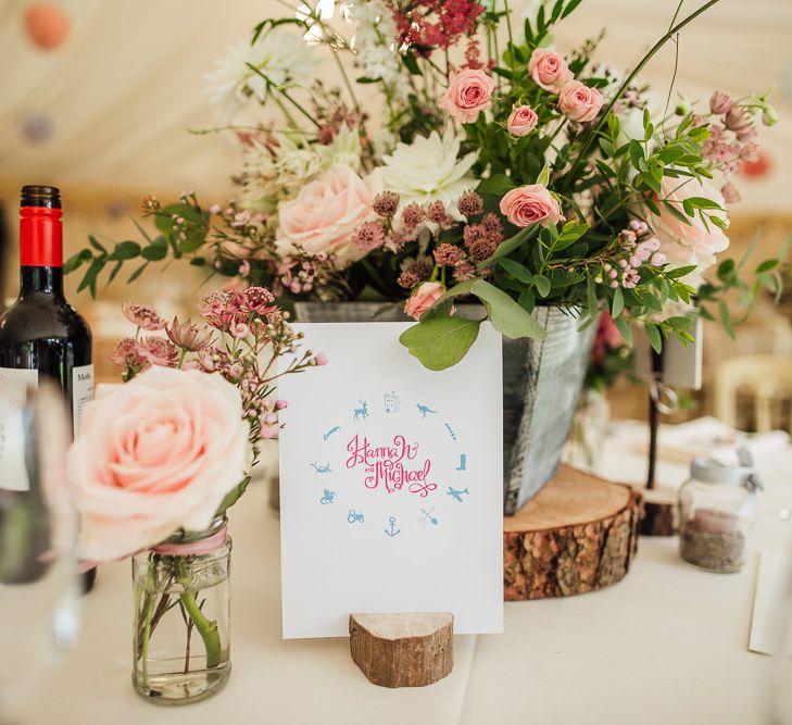 Pink Wild Flower Centrepieces on Rustic Tree Slab