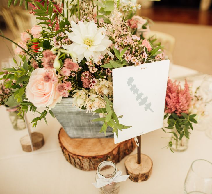 Pink Wild Flower Centrepieces on Rustic Tree Slab