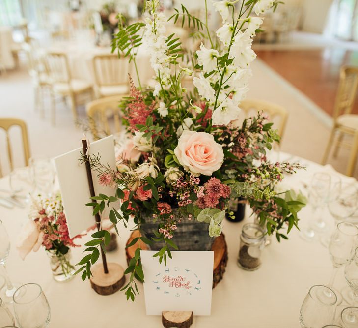 Pink Wild Flower Centrepieces on Rustic Tree Slab