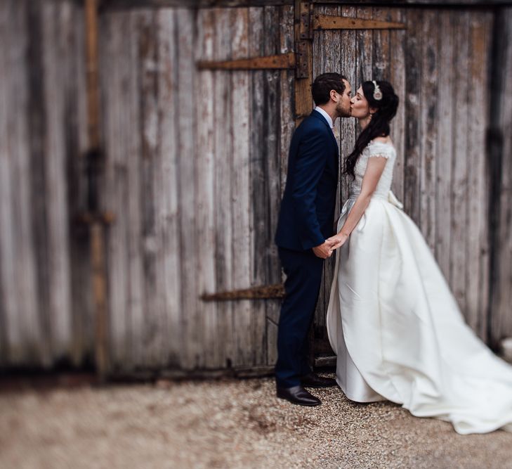 Bride in Aire Barcelona Bridal Gown & Groom in Ted Baker Suit