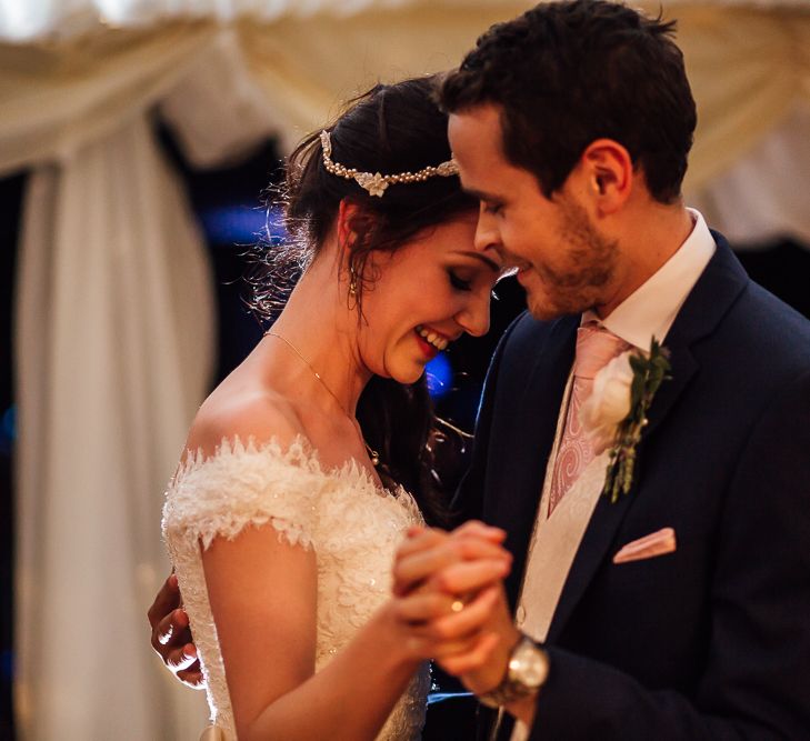 Bride in Aire Barcelona Bridal Gown & Groom in Ted Baker Suit