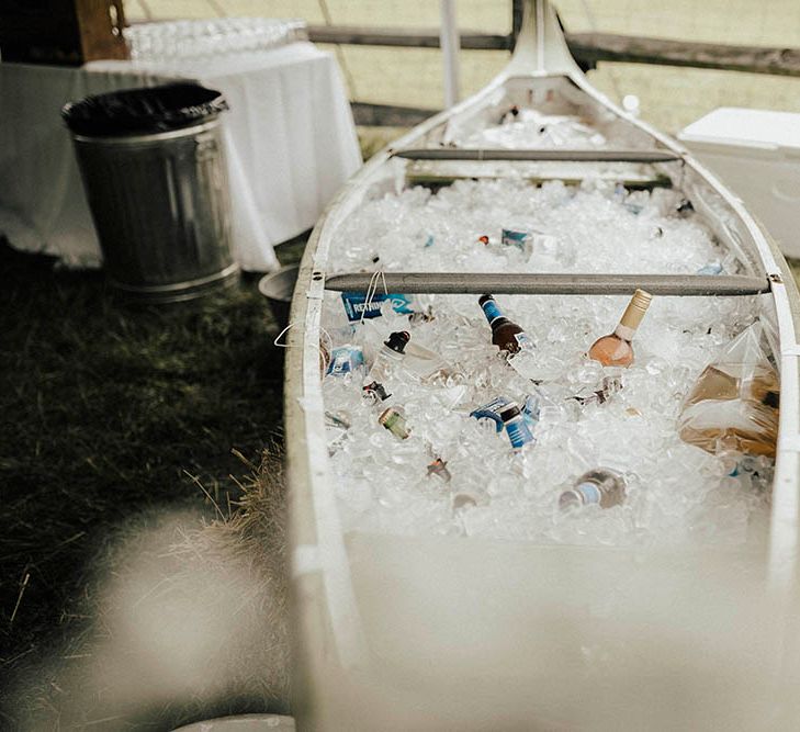 Canoe Filled With Beer For Wedding | Jenny Yoo Bride For An Outdoor Farm Wedding In Maryland USA With Bridesmaids In Mismatched Dresses & Images From Erin Krespan