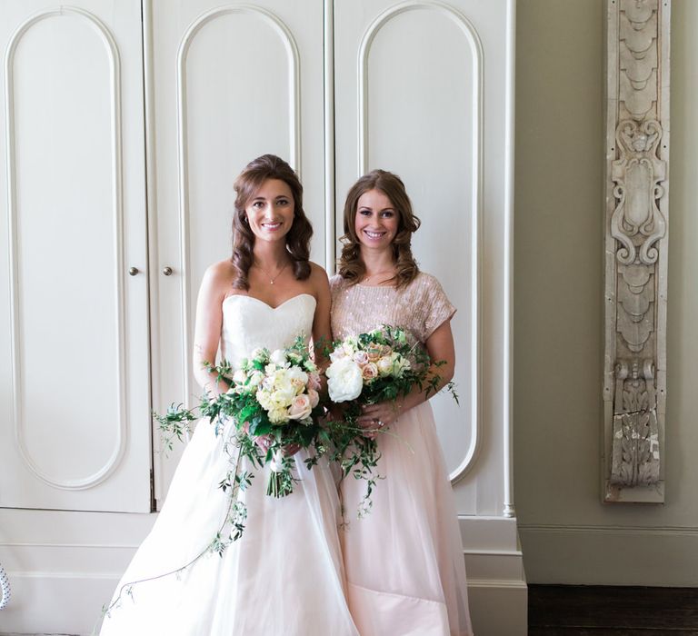 Bride in Sarah Bussey from Ivory & Co. Gown | Bridesmaid in Pink Coast Sequin Top & High Low Skirt Separates | Elegant Blush Pink & White Wedding at Aynhoe Park in Oxfordshire | Lucy Davenport Photography