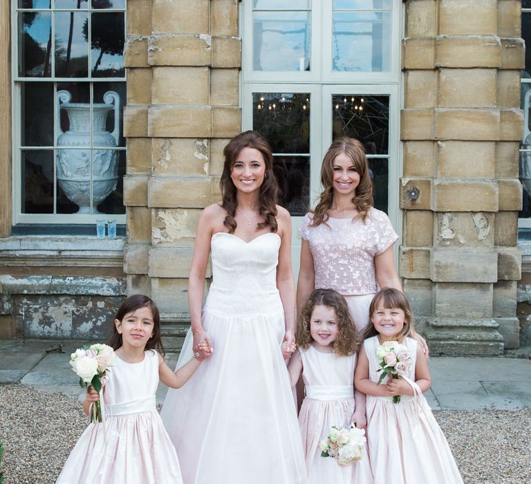 Flower Girls in Nicki MacFarlane Outfits | Bride in Sarah Bussey from Ivory & Co. Gown | Bridesmaid in Pink Coast Sequin Top & High Low Skirt Separates | Elegant Blush Pink & White Wedding at Aynhoe Park in Oxfordshire | Lucy Davenport Photography