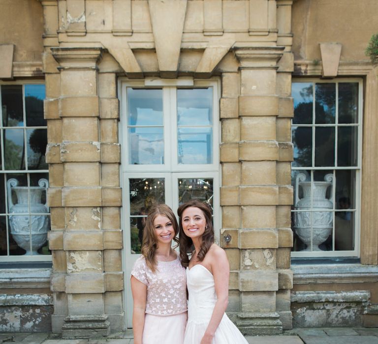 Bride in Sarah Bussey from Ivory & Co. Gown | Bridesmaid in Pink Coast Sequin Top & High Low Skirt Separates | Elegant Blush Pink & White Wedding at Aynhoe Park in Oxfordshire | Lucy Davenport Photography