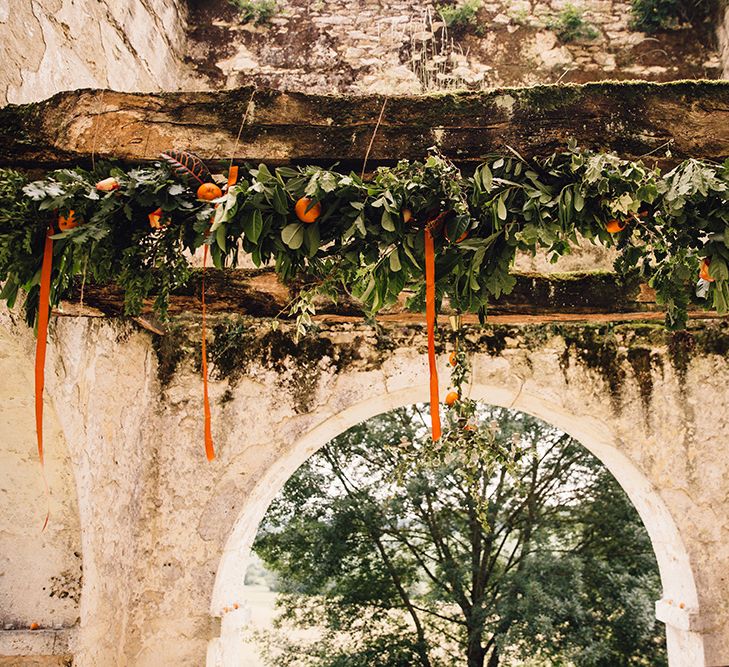 Greenery & Orange Wedding Floral Arrangement