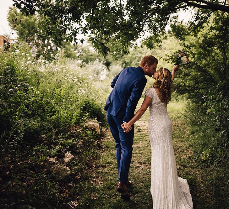 Bride in Eliza Jane Howell Gown & Groom in Navy Paul Smith Suit