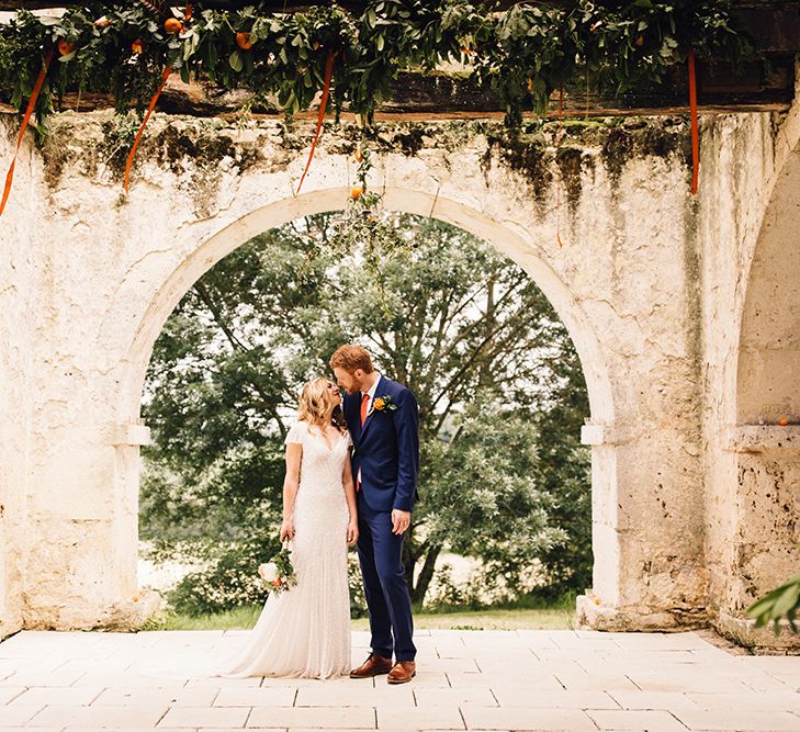 Bride in Eliza Jane Howell Gown & Groom in Navy Paul Smith Suit