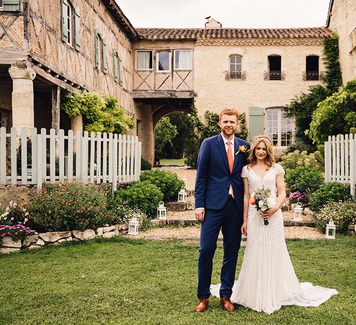 Bride in Eliza Jane Howell Gown & Groom in Navy Paul Smith Suit