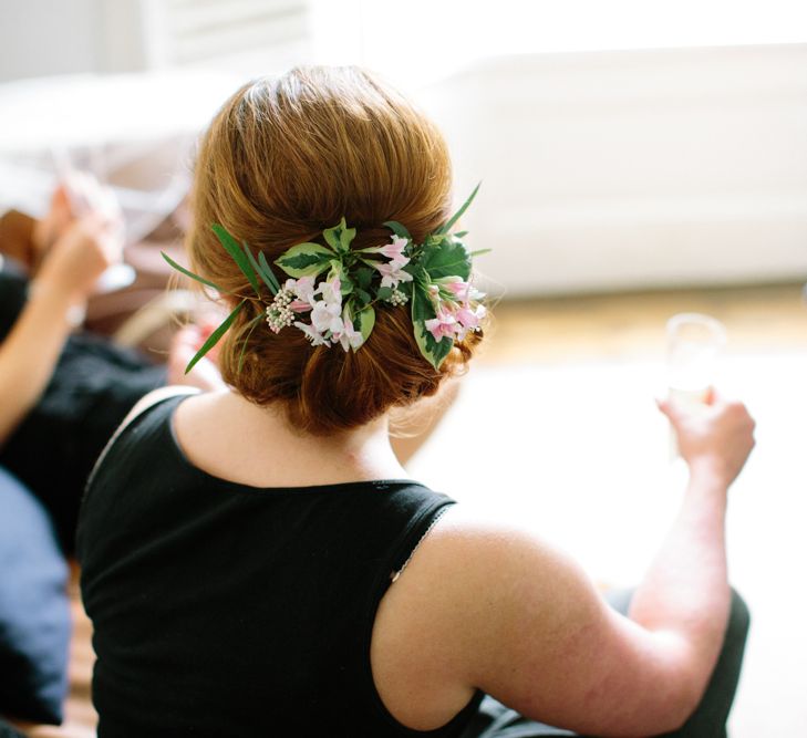 Bridesmaid Up Do with Flowers | Stylish Hackney Town Hall Wedding | Camilla Arnhold Photography | This Modern Revelry Film