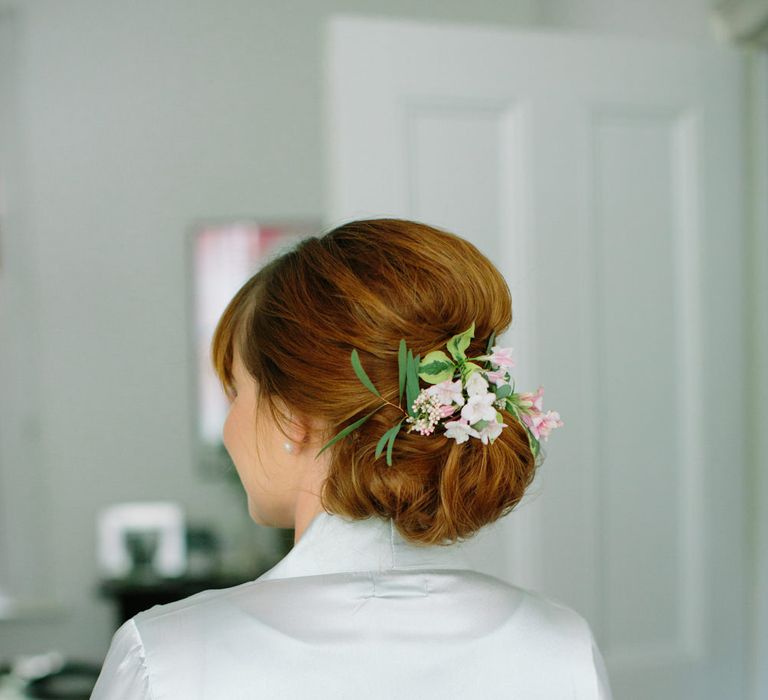 Bridesmaid Chic Chignon with Flowers | Stylish Hackney Town Hall Wedding | Camilla Arnhold Photography | This Modern Revelry Film