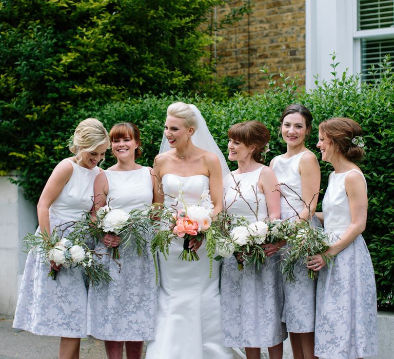 Bridesmaids in Grey & White Oasis Dresses | Bride in Anna Serrano Gown | Groom in Grey Suit | Stylish Hackney Town Hall Wedding | Camilla Arnhold Photography | This Modern Revelry Film