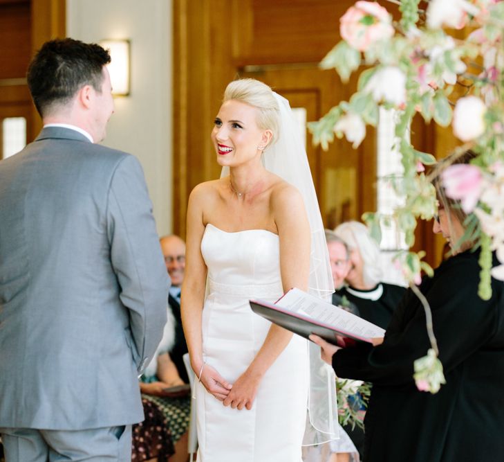 Wedding Ceremony | Bride in Anna Serrano Gown | Groom in Grey Suit | Stylish Hackney Town Hall Wedding | Camilla Arnhold Photography | This Modern Revelry Film