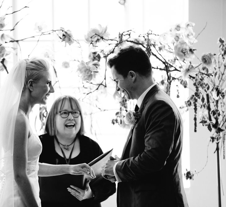 Wedding Ceremony | Bride in Anna Serrano Gown | Groom in Grey Suit | Stylish Hackney Town Hall Wedding | Camilla Arnhold Photography | This Modern Revelry Film