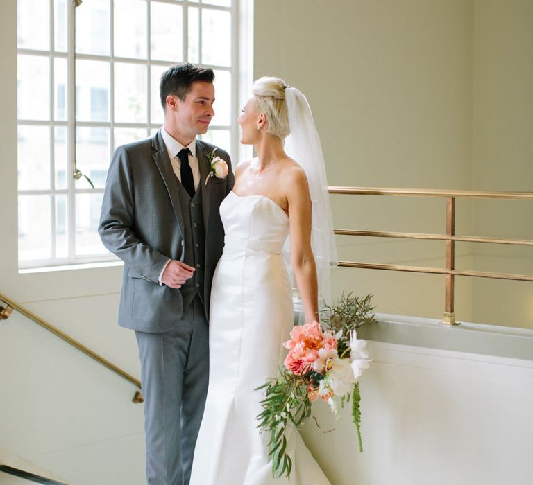 Bride in Anna Serrano Gown | Groom in Grey Suit | Stylish Hackney Town Hall Wedding | Camilla Arnhold Photography | This Modern Revelry Film