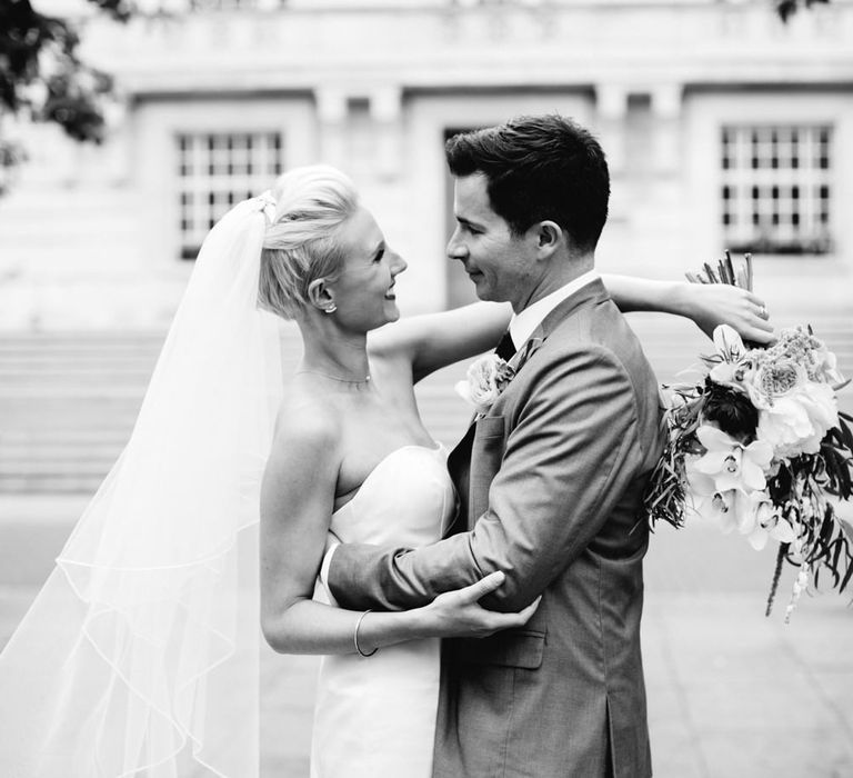 Bride in Anna Sorrano Gown | Groom in Grey Suit | Stylish Hackney Town Hall Wedding | Camilla Arnhold Photography | This Modern Revelry Film