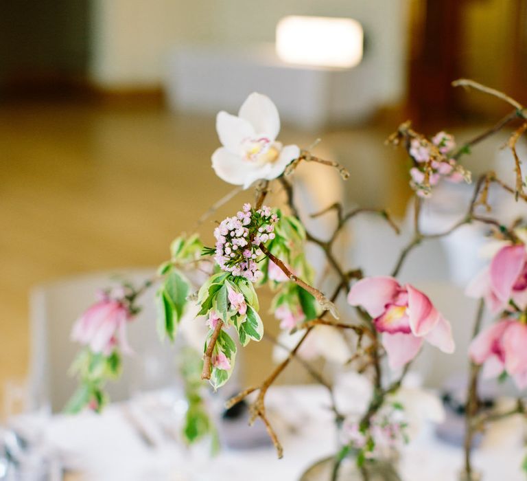 Magnolia Branch Centrepieces | Stylish Hackney Town Hall Wedding | Camilla Arnhold Photography | This Modern Revelry Film