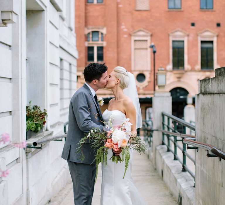 Bride in Anna Sorrano Gown | Groom in Grey Suit | Stylish Hackney Town Hall Wedding | Camilla Arnhold Photography | This Modern Revelry Film