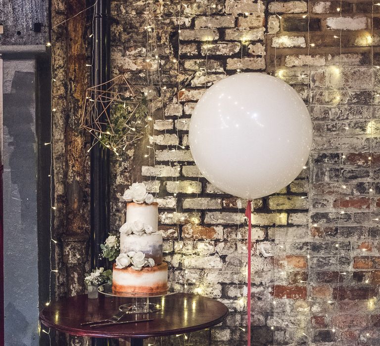 White & Copper Wedding Cake with Giant Balloon | Contemporary City Wedding at People's History Museum & Hope Mill Theatre, Manchester Planned by Alternative Weddings MCR | Babb Photography