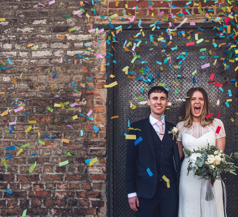 Confetti Moment | Bride in Leonora Watters Gown | Groom in Navy Suit | Contemporary City Wedding at People's History Museum & Hope Mill Theatre, Manchester Planned by Alternative Weddings MCR | Babb Photography