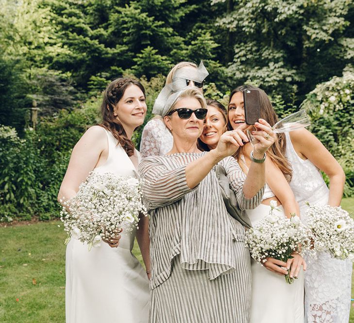 Bride & Bridesmaids in White Dresses by Harriet Holling