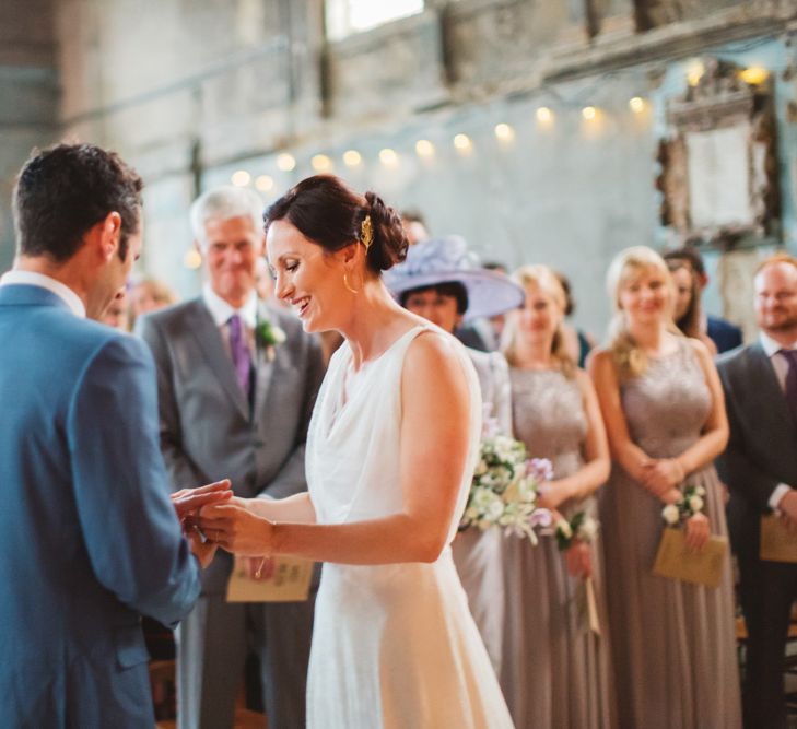 Bride & Groom Exchanging Rings at Asylum Wedding Ceremony